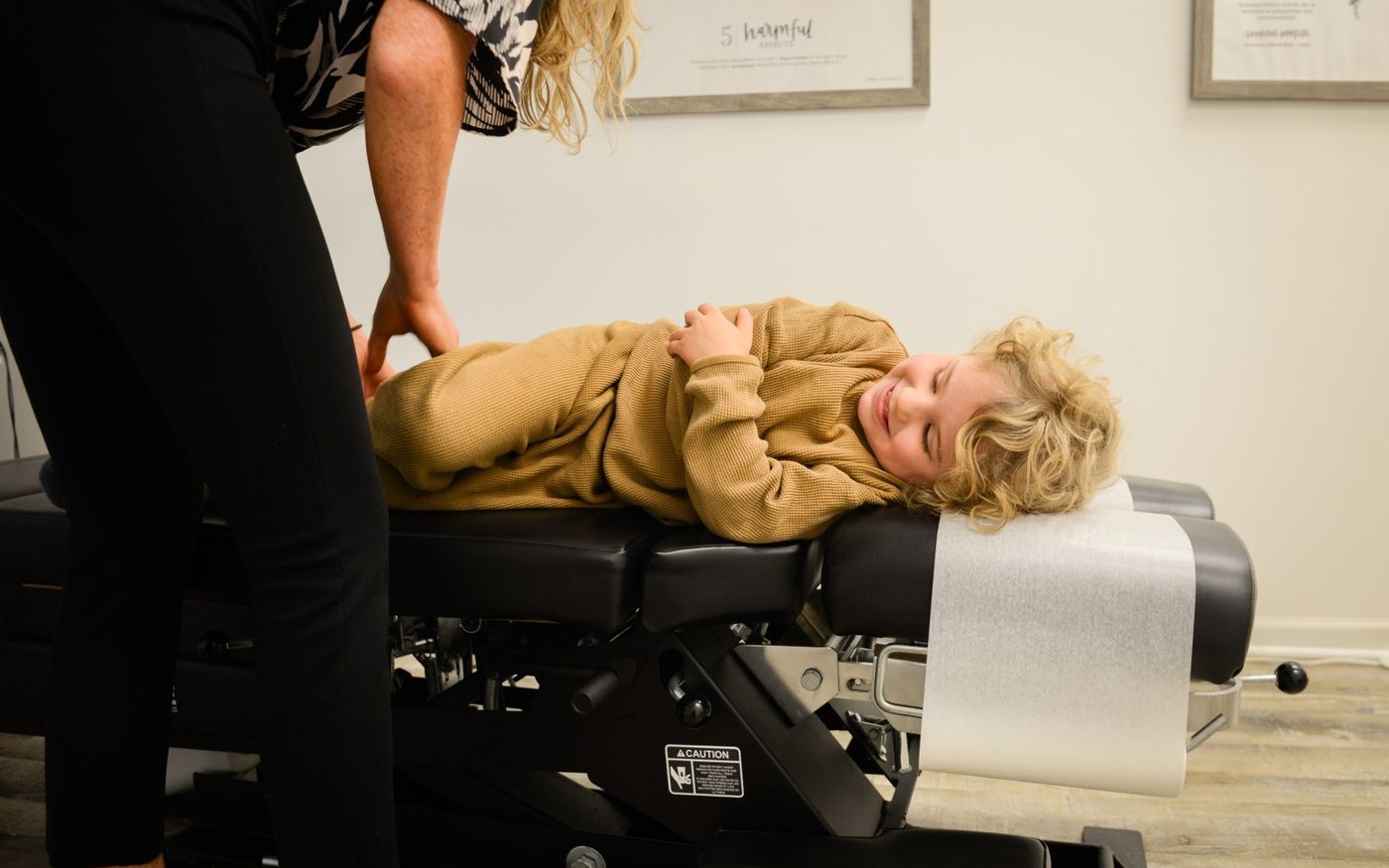 A child being adjusted at Mequon Family Chiropractic